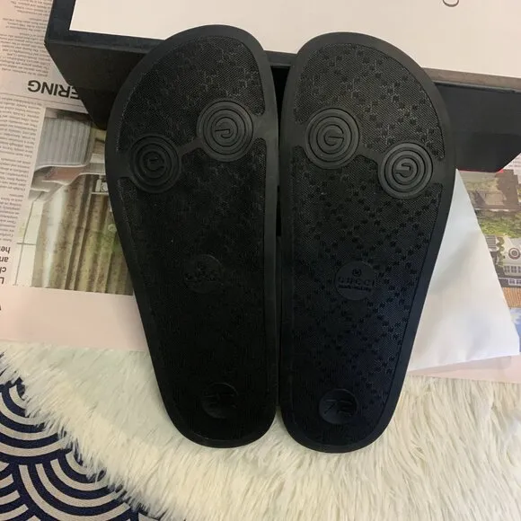Authentic Gucci rubber slides with tiger detailing