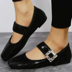 Black sequin flats with crystal and metal strap embellishments.