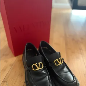 Valentino Black and Gold Leather Loafers